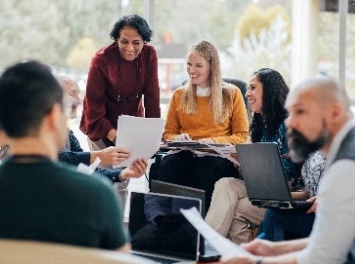 A group of people having a meeting.