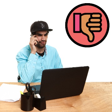 A person using a laptop and taking a phone call. Above them is a thumbs down icon.