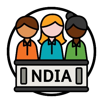 A group of people behind a bench that has 'NDIA' printed on the front of it.