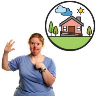 A woman with a disability standing in front of a picture of a house