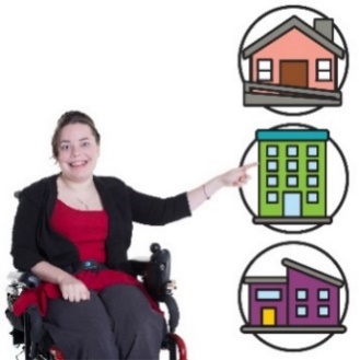 A woman in a wheelchair pointing to a selection of houses