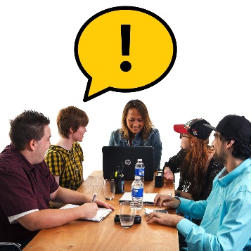 A group of members having a conversation at a desk. Above them is a speech bubble with an importance icon.