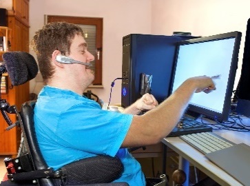 A person using assistive technology to access their computer.