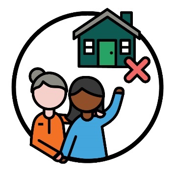 A worker supporting a participant. The participant is pointing to a house with a cross.
