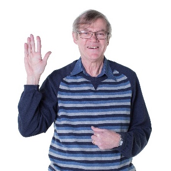 An older man pointing at himself. 